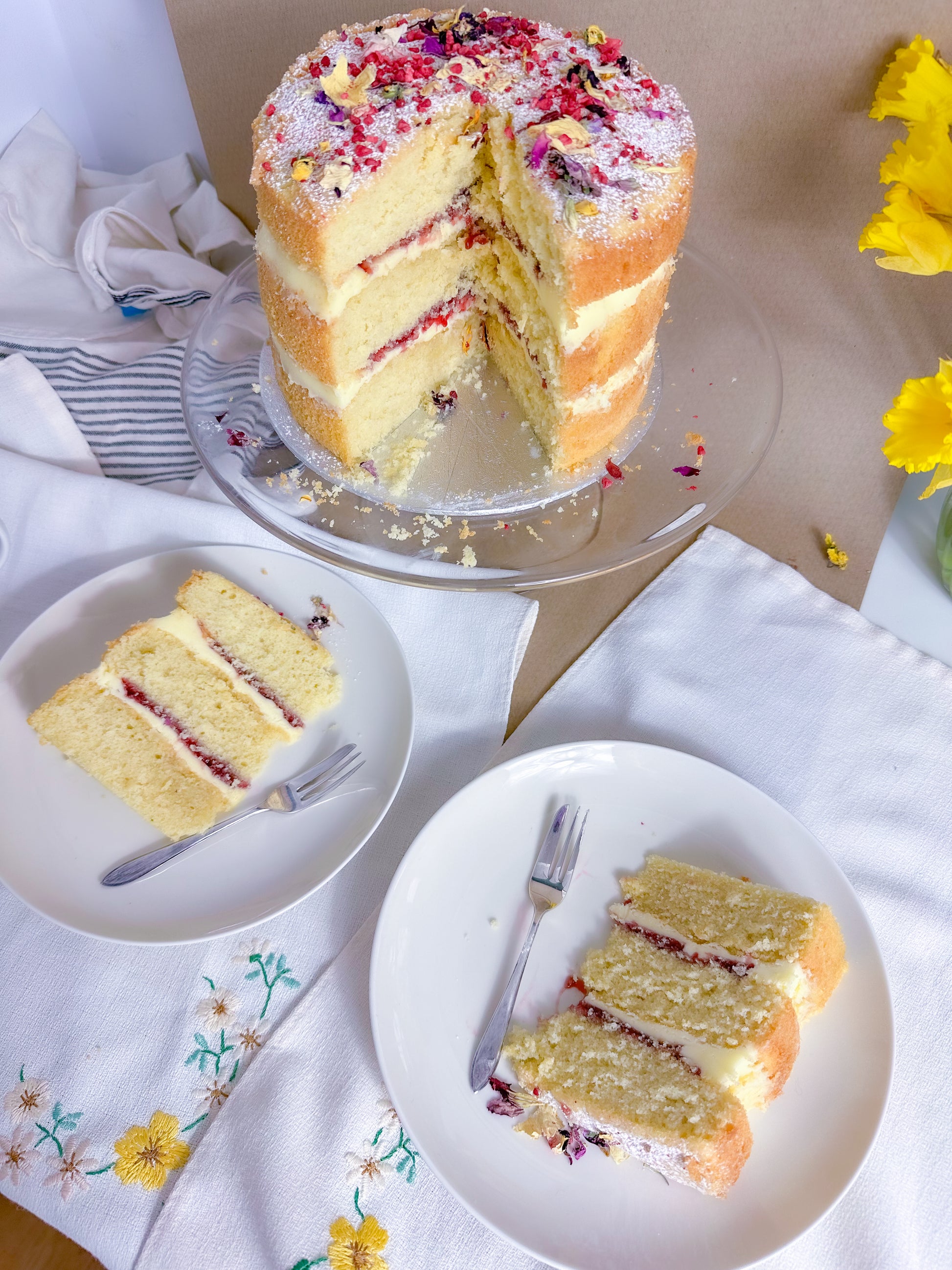 Freshly baked Victoria sponge cake with cream and jam filling